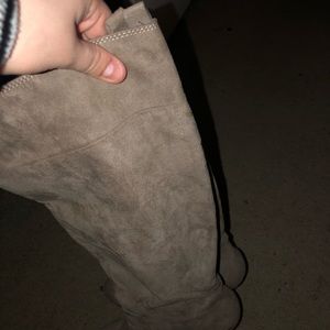 well worn knee high boot heels